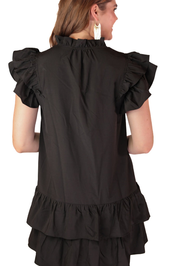 frilly ruffle sleeves & a tiered ruffle bottom adorned with a sequin football pattern on black fabric