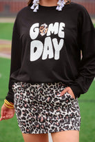 black long-sleeve sweatshirt with white chenille patch lettering reading GAME DAY in uppercase letters and a leopard football as the A in Game Day