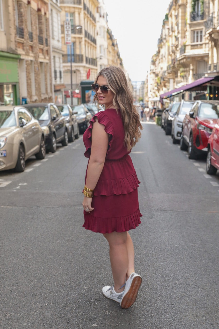 ruffled sleeve dress with layered pleats, an elastic waistband, and a lined bottom in burgundy
