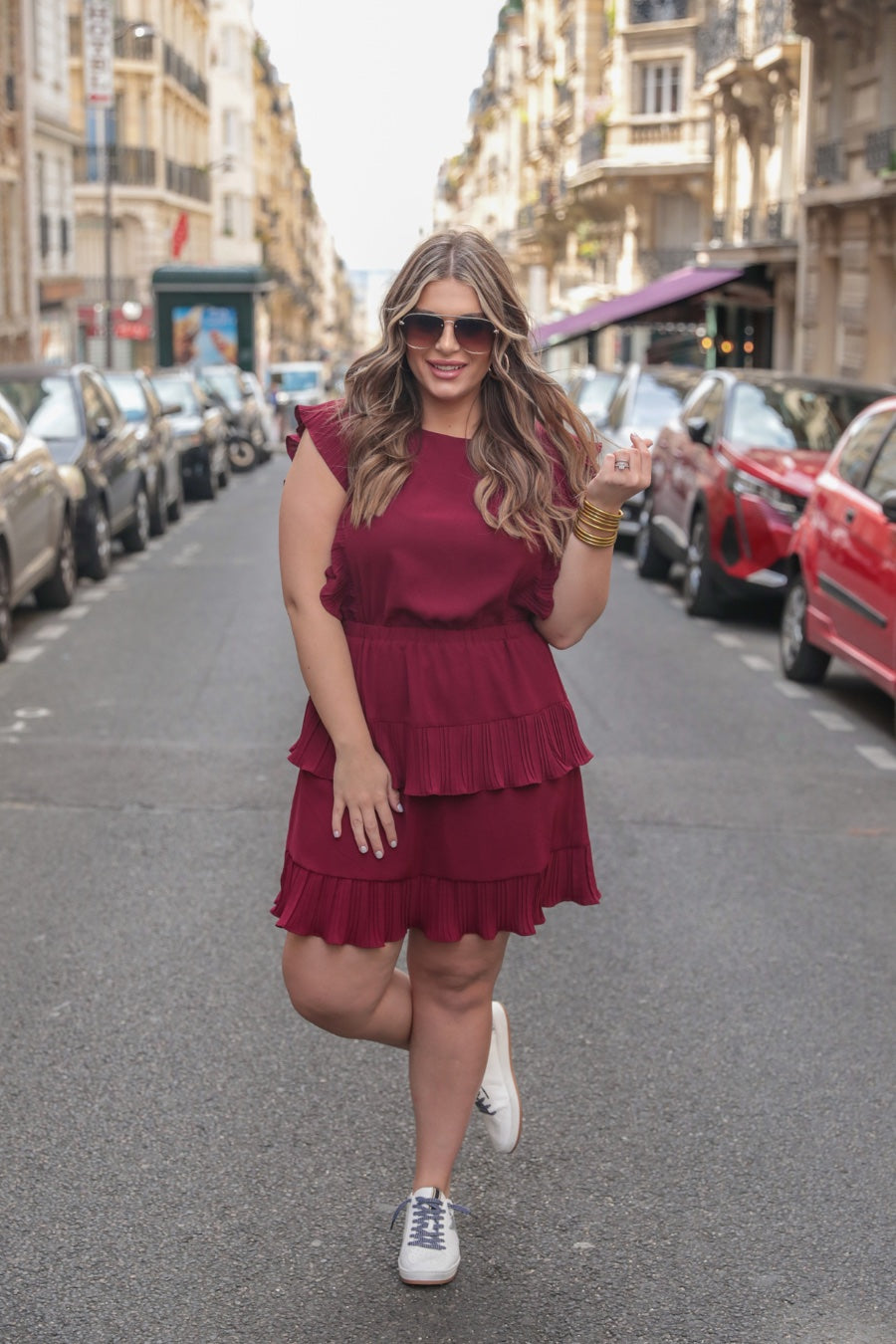 ruffled sleeve dress with layered pleats, an elastic waistband, and a lined bottom in burgundy