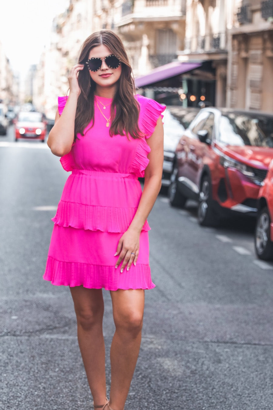 ruffled sleeve dress with layered pleats, an elastic waistband, and a lined bottom in pink