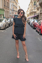 ruffled sleeve dress with layered pleats, an elastic waistband, and a lined bottom in black