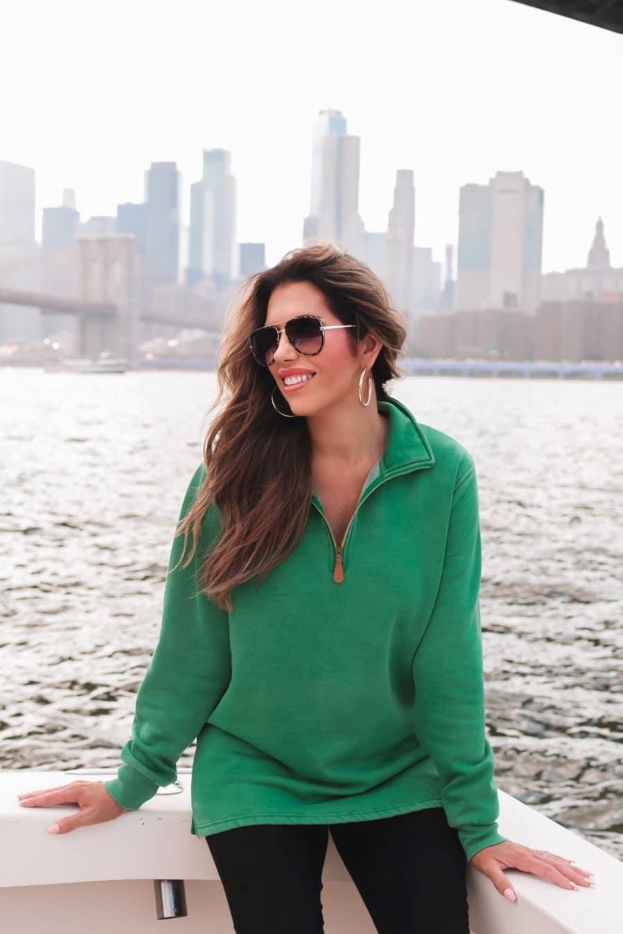 grey aviator sunglasses with thin round wireframes, tinted lenses, UV protection, and brand name detail (on both the temple and the complimentary black pouch)