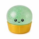 a mint green mystery dumpling-shaped squishy fidget with assorted surprise colors, glittery finish, kawaii face, soft squeezable texture, and glow-in-the-dark feature