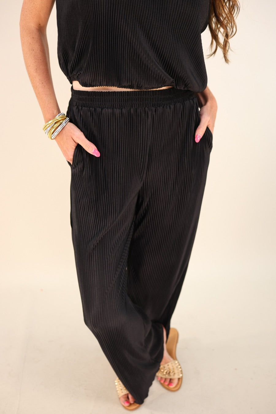 black pleated two-piece elastic button keyhole back top and elastic waistband bottoms with flowy legs and pockets