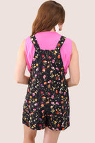 multicolor floral pattern print overall shorts on a black base made from our best-selling everyday fabric with functional button straps, cuffed hems, and side pockets