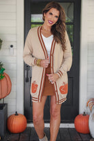 long-sleeve open front cardigan adorned with chenille pumpkins and sequin bows, functional pockets, and a relaxed fit in neutral