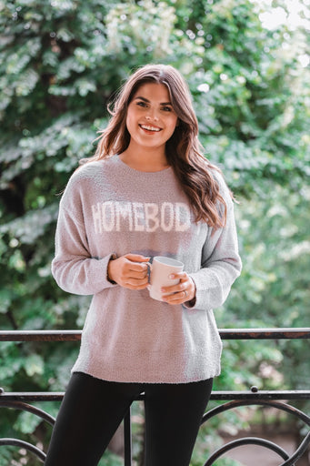 grey sweater made of blanket material with long sleeves & "HOMEBODY" wording in white