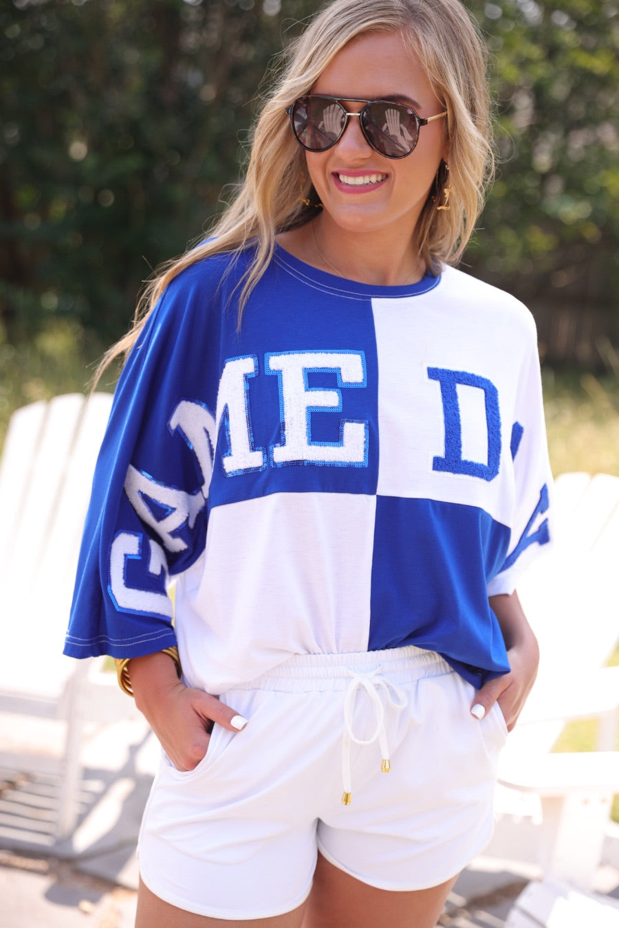 short-sleeve color block mom crop top with oversized chenille 'GAME DAY' lettering outlined in sequins, where GAME pops with a coordinating color outline to match the color block style, while DAY stands out with a crisp white outline in blue