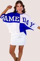 short-sleeve color block mom crop top with oversized chenille 'GAME DAY' lettering outlined in sequins, where GAME pops with a coordinating color outline to match the color block style, while DAY stands out with a crisp white outline in blue