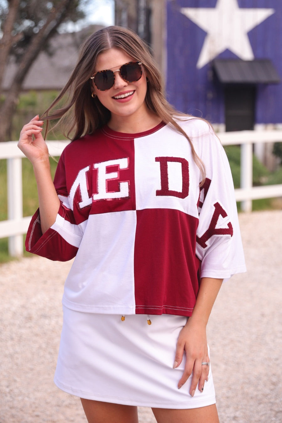 short-sleeve color block mom crop top with oversized chenille 'GAME DAY' lettering outlined in sequins, where GAME pops with a coordinating color outline to match the color block style, while DAY stands out with a crisp white outline in maroon