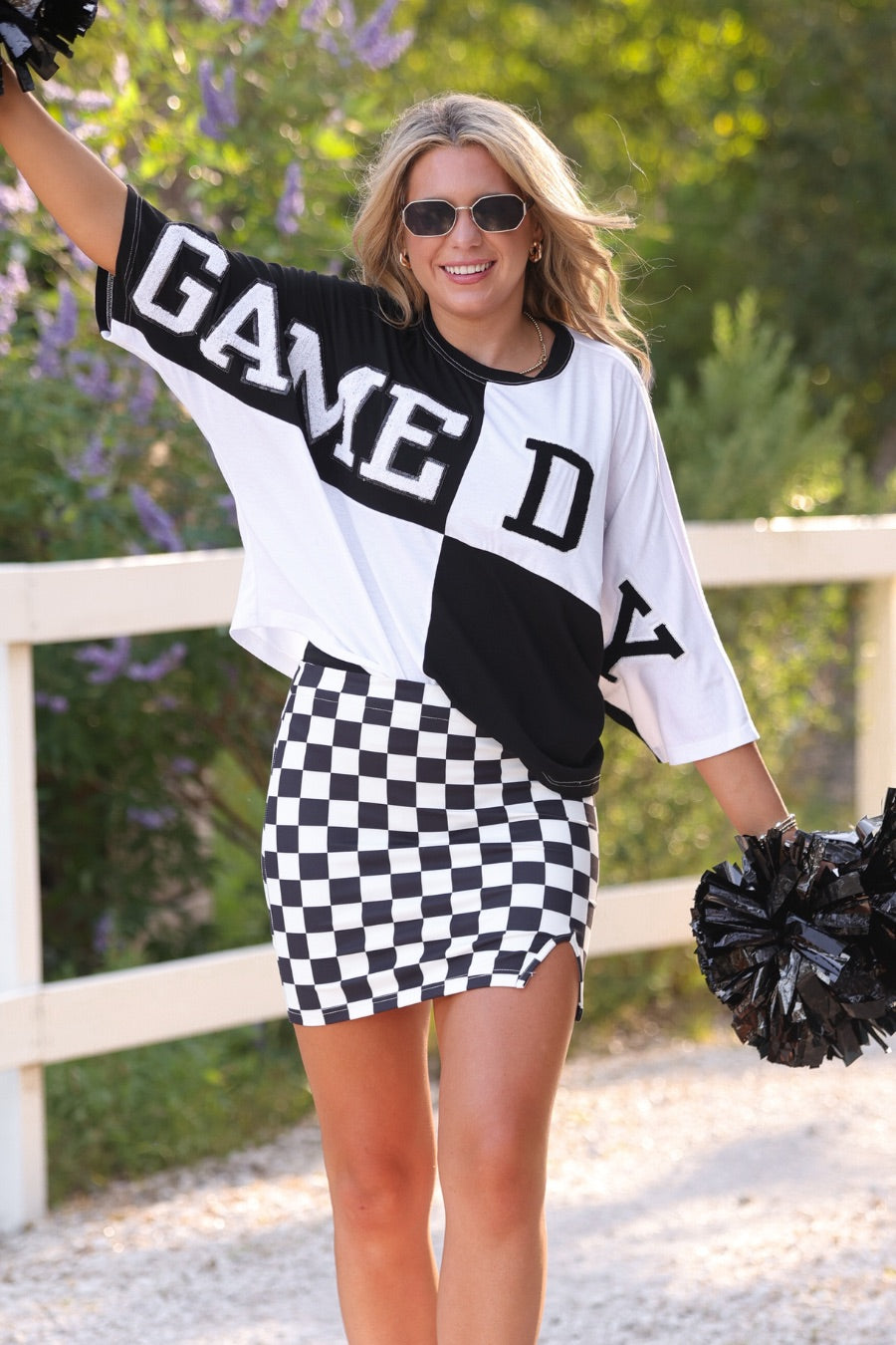 short-sleeve color block mom crop top with oversized chenille 'GAME DAY' lettering outlined in sequins, where GAME pops with a coordinating color outline to match the color block style, while DAY stands out with a crisp white outline in black