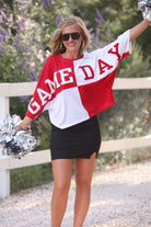 short-sleeve color block mom crop top with oversized chenille 'GAME DAY' lettering outlined in sequins, where GAME pops with a coordinating color outline to match the color block style, while DAY stands out with a crisp white outline in red