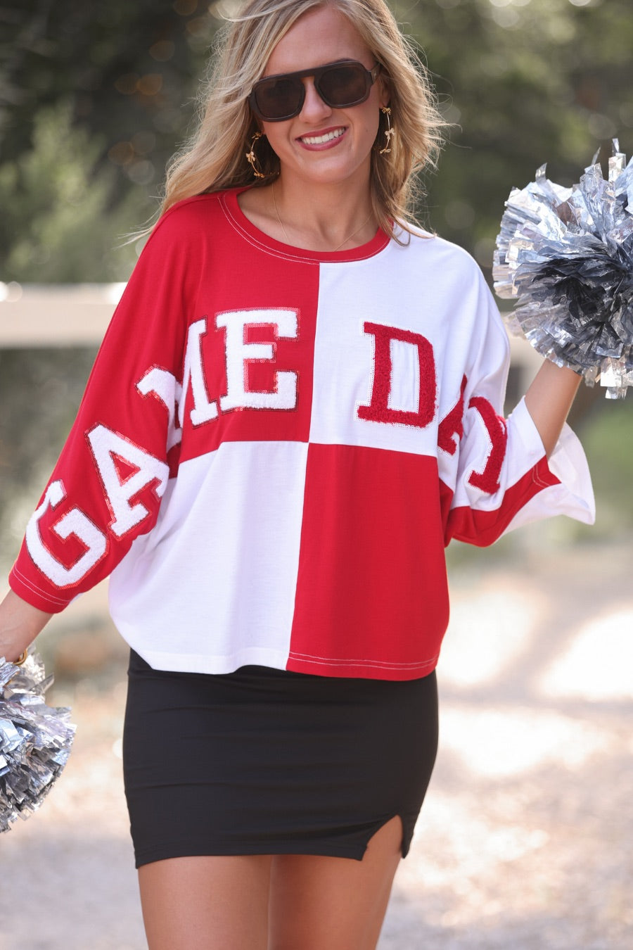 short-sleeve color block mom crop top with oversized chenille 'GAME DAY' lettering outlined in sequins, where GAME pops with a coordinating color outline to match the color block style, while DAY stands out with a crisp white outline in red