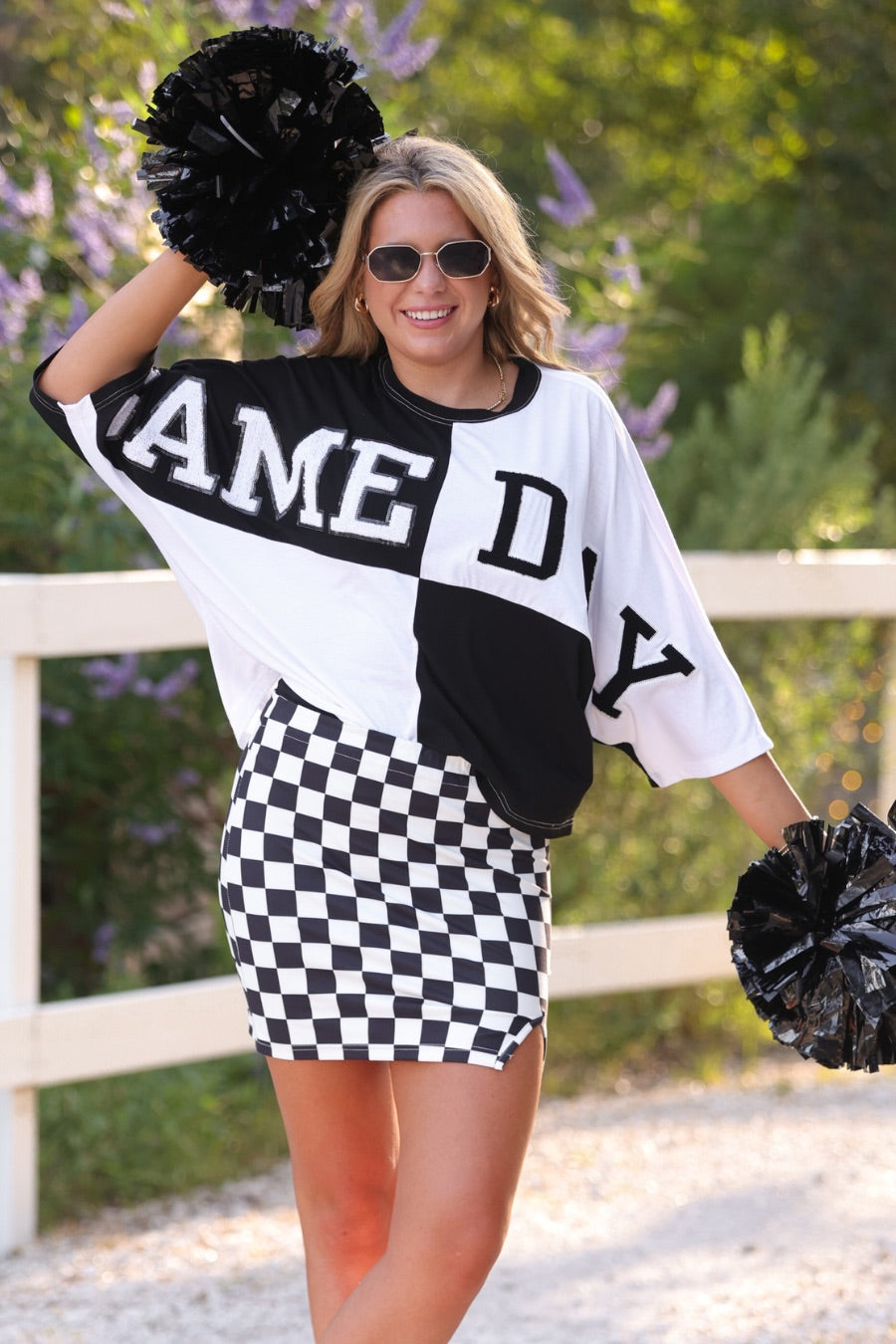 short-sleeve color block mom crop top with oversized chenille 'GAME DAY' lettering outlined in sequins, where GAME pops with a coordinating color outline to match the color block style, while DAY stands out with a crisp white outline in black