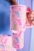 a 40-ounce tumbler with a charming bunny print design, handle, screw-on lid, and a reusable straw