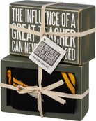 Boxed set of socks with a decorative tag and text on a white background
