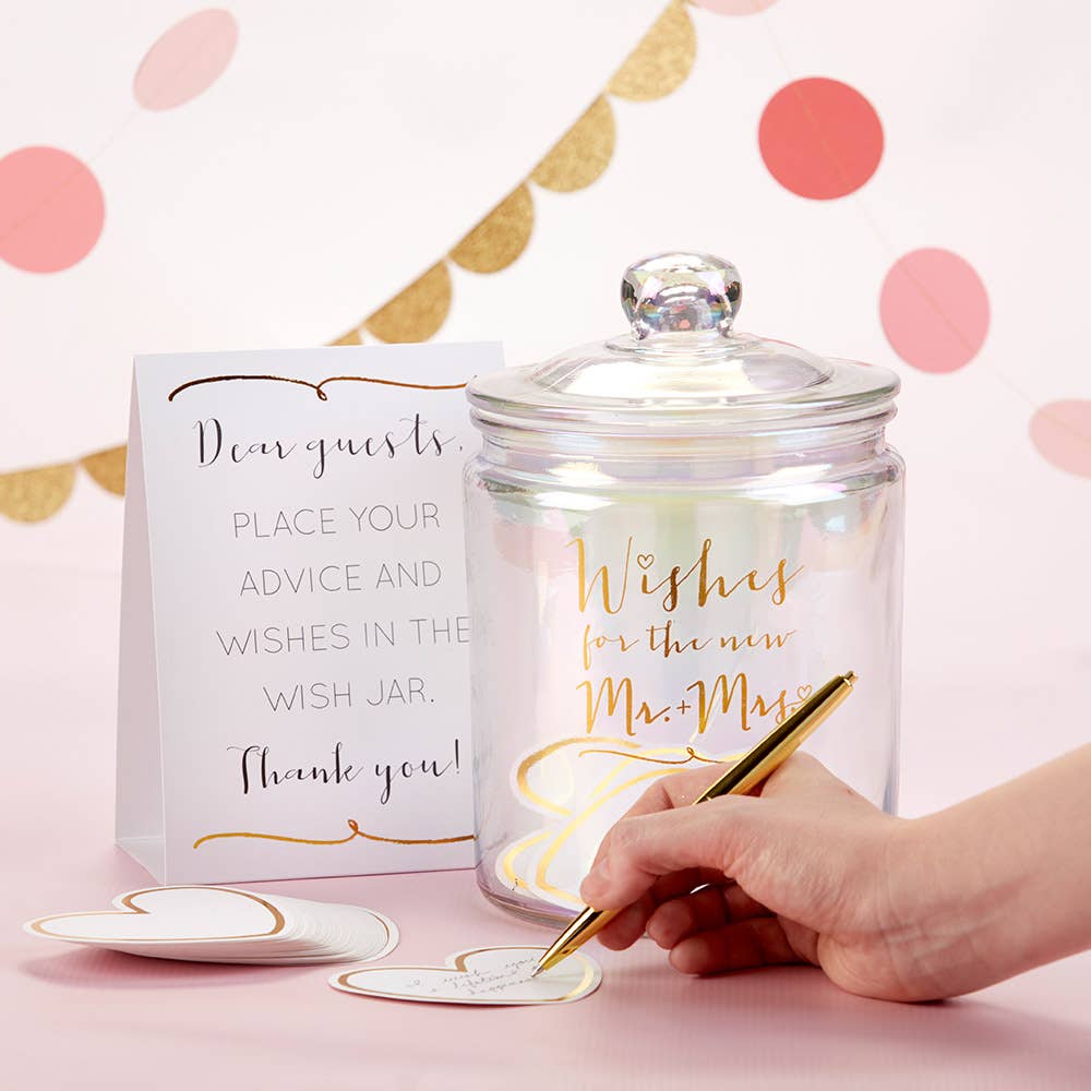 Wish jar with decorative text and a hand writing on a card against a polka dot background