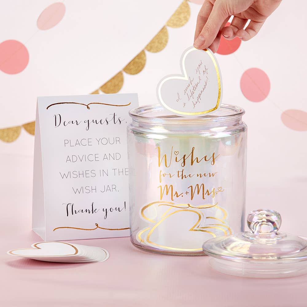 Wish jar with heart-shaped tag for wedding wishes on a pink background