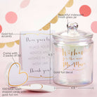 Iridescent glass wish jar with gold foil accents and a card for guests to write wishes.