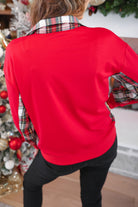 red long-sleeve pullover with a gold quarter-zip foldable collar and multicolor Scottish tartan plaid inserts on the neckline, sides, and underarms