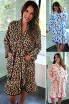 a long sleeve robe with a flattering wrap silhouette, an adjustable waist tie, a playful ruffle hem, and deep patch pockets on ultra plush fabric in Blue Blossom (Blue), Daylight Bow (Multi), and Safari Chic (Leopard)
