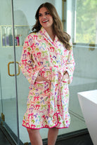 a long sleeve robe with a flattering wrap silhouette, an adjustable waist tie, a playful ruffle hem, and deep patch pockets on ultra plush fabric in Daylight Bow (Multi)