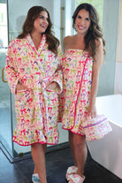 a long sleeve robe with a flattering wrap silhouette, an adjustable waist tie, a playful ruffle hem, and deep patch pockets on ultra plush fabric in Daylight Bow (Multi)