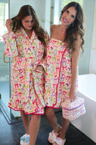 a long sleeve robe with a flattering wrap silhouette, an adjustable waist tie, a playful ruffle hem, and deep patch pockets on ultra plush fabric in Daylight Bow (Multi)