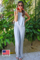 made in USA sleeveless one-piece jumpsuit with 2.5" straps, a keyhole button back, an elastic waist, flare leg, and pockets in 