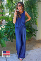 made in USA sleeveless one-piece jumpsuit with 2.5" straps, a keyhole button back, an elastic waist, flare leg, and pockets in navy