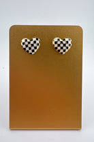 vibrant black heart-shaped stud with a comfort earring back in gold