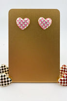 vibrant pink heart-shaped stud with a comfort earring back in gold