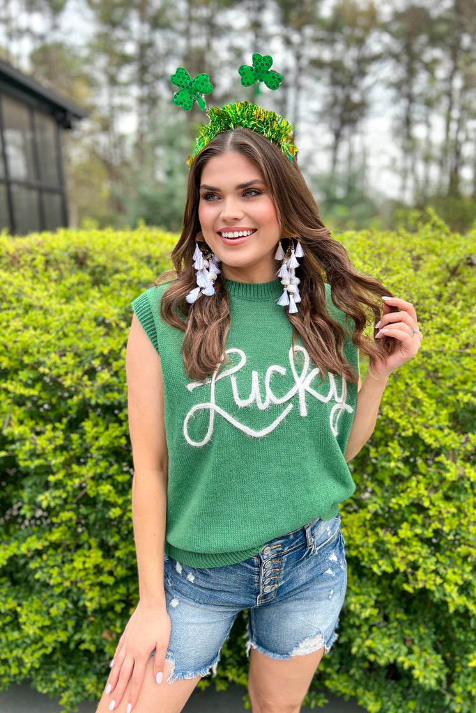 green sleeveless sweater vest with LUCKY tinsel white lettering