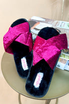 magenta velvet slippers with criss-cross pattern and rubber bottom