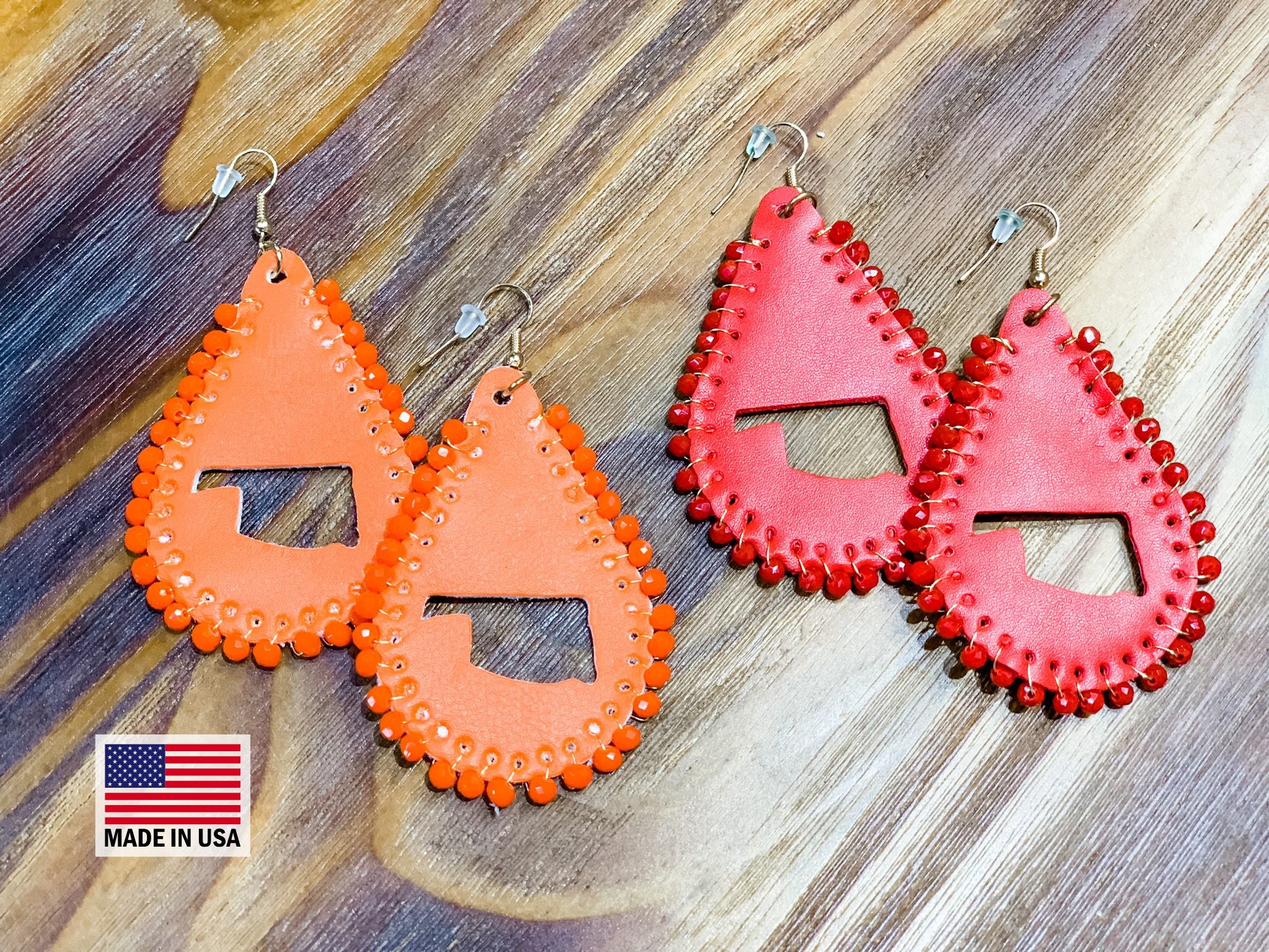 leather teardrop earrings with the State of Oklahoma cutout in the center, matching beading accent over the edges, and a fish hook