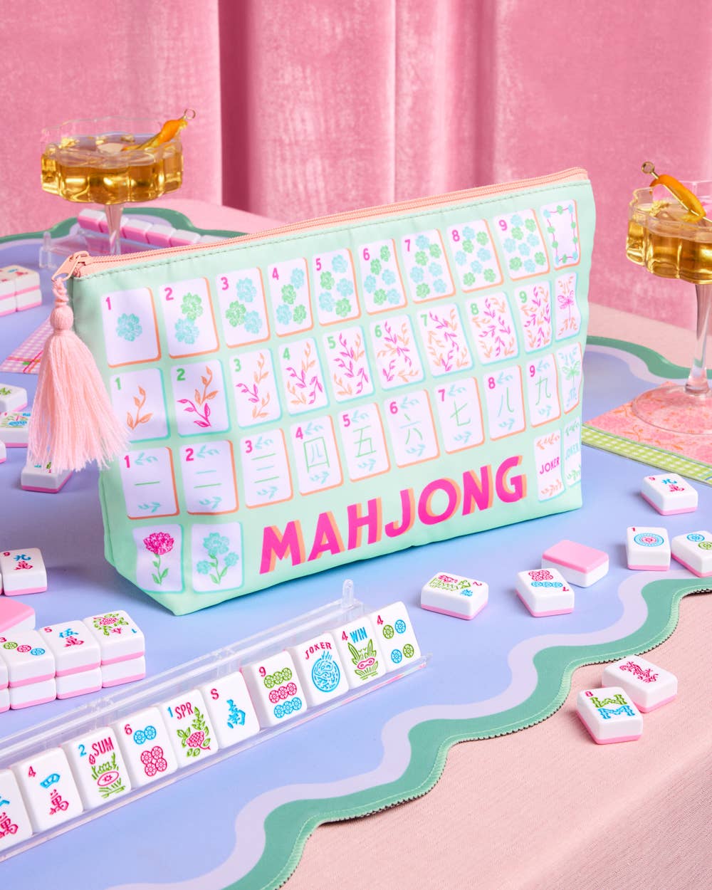 a soft nylon mahjong zipper bag with a pastel tile print, pink tassel pull, smooth top closure, and interior zipper pocket