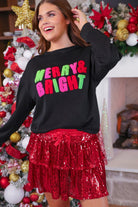 black long-sleeve sweatshirt with stitched chenille patches that spell out MERRY BRIGHT with an ampersand in between in alternating green, pink, and red on our new luxe material