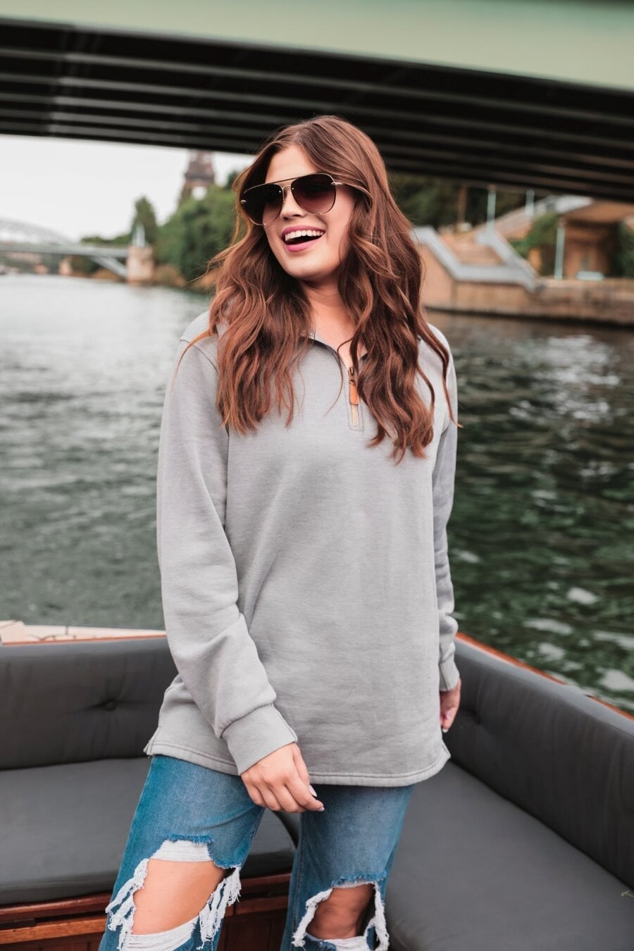 long sleeve pullover crafted from vintage wash fabric with a foldable collar, side slits, and a quarter zip in grey