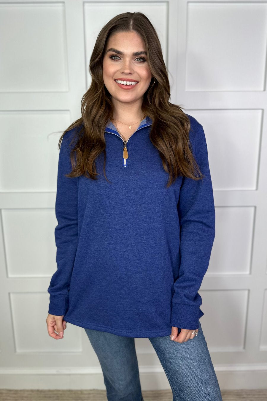 long sleeve pullover crafted from vintage wash fabric with a foldable collar, side slits, and a quarter zip in navy