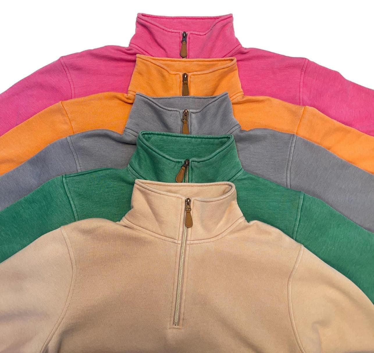 long sleeve pullover crafted from vintage wash fabric with a foldable collar, side slits, and a quarter zip in green, grey, orange, pink, and tan