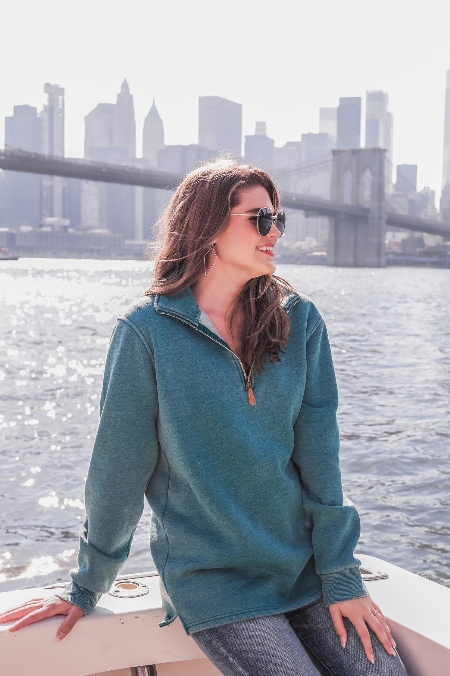 long sleeve pullover crafted from vintage wash fabric with a foldable collar, side slits, and a quarter zip in teal