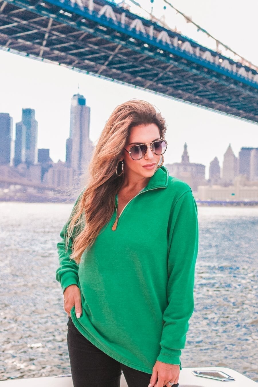 long sleeve pullover crafted from vintage wash fabric with a foldable collar, side slits, and a quarter zip in green