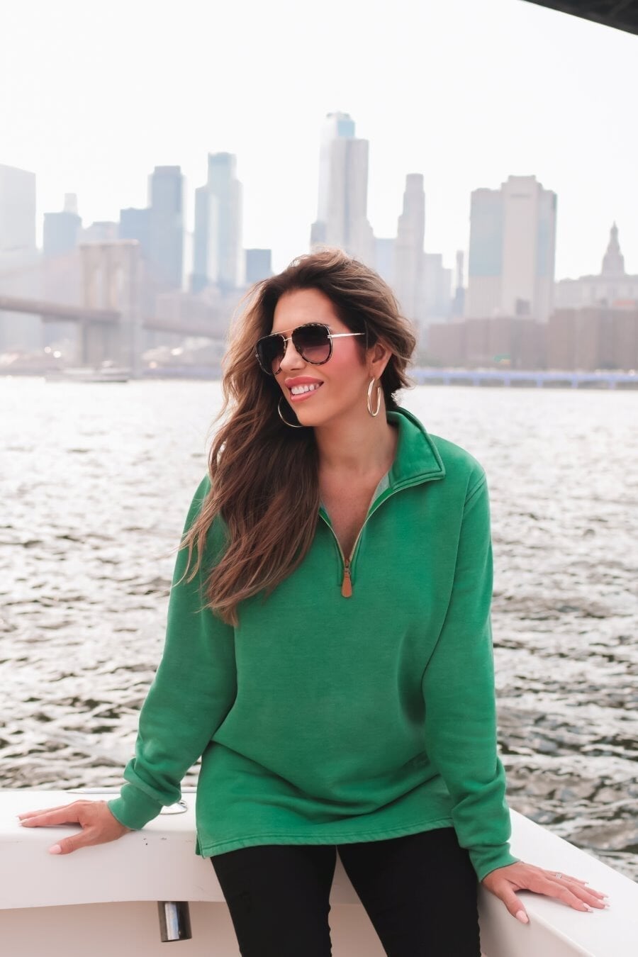 long sleeve pullover crafted from vintage wash fabric with a foldable collar, side slits, and a quarter zip in green