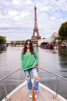 long sleeve pullover crafted from vintage wash fabric with a foldable collar, side slits, and a quarter zip in green