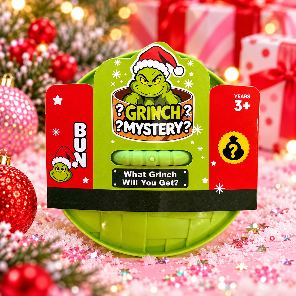 a lime green glitter-filled Grinch-inspired dumpling squishy with a soft, squeezable texture, rounded steamed-bun silhouette, mischievous facial design, and coordinating steamer-style container