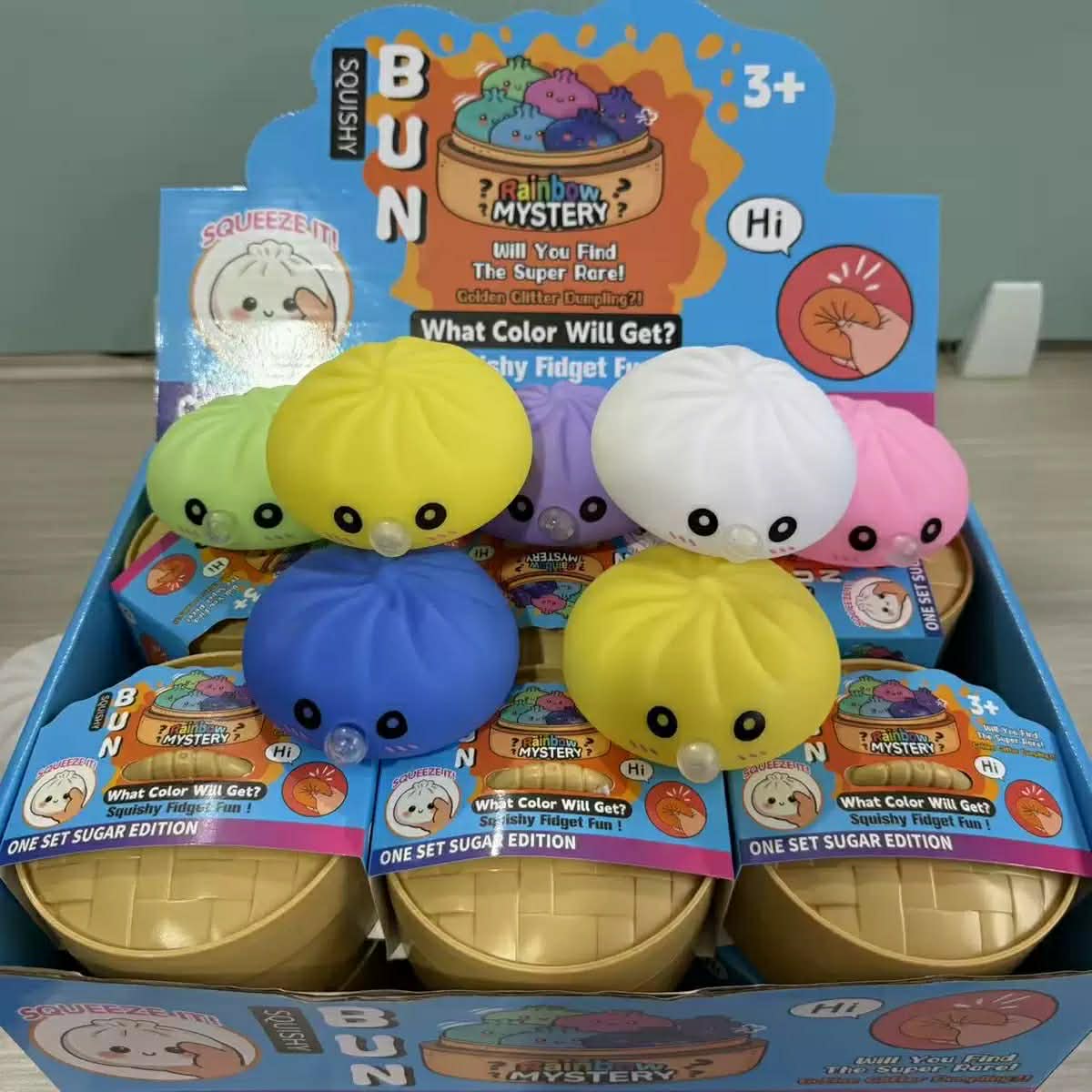 a mystery dumpling-shaped squishy fidget with assorted surprise colors, a soft sensory feel, and a bubble-blowing mouth detail