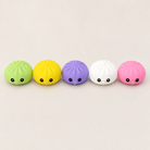 a mystery dumpling-shaped squishy fidget with assorted surprise colors, a soft sensory feel, and a bubble-blowing mouth detail