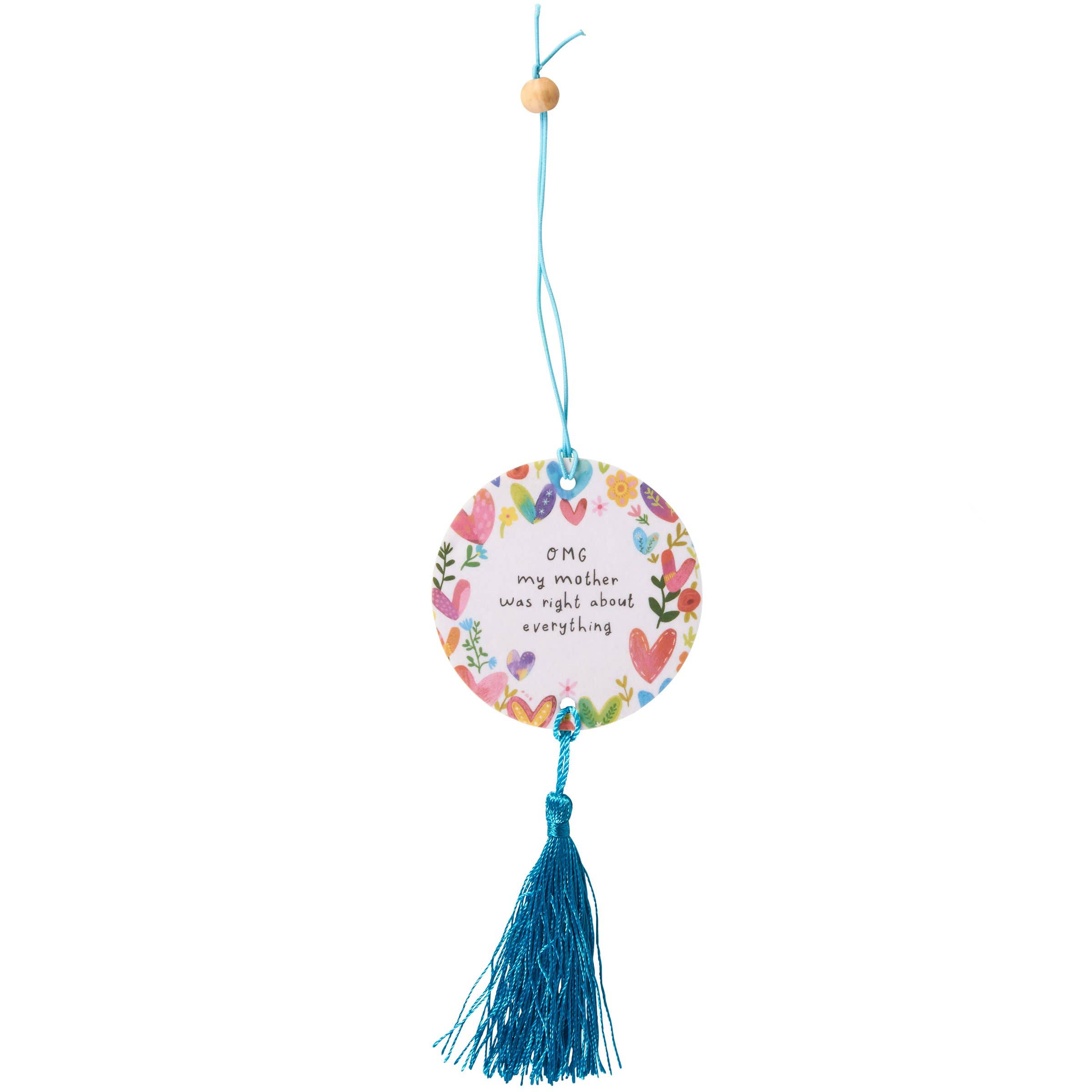 Decorative hanging tag with floral design and tassel on a white background