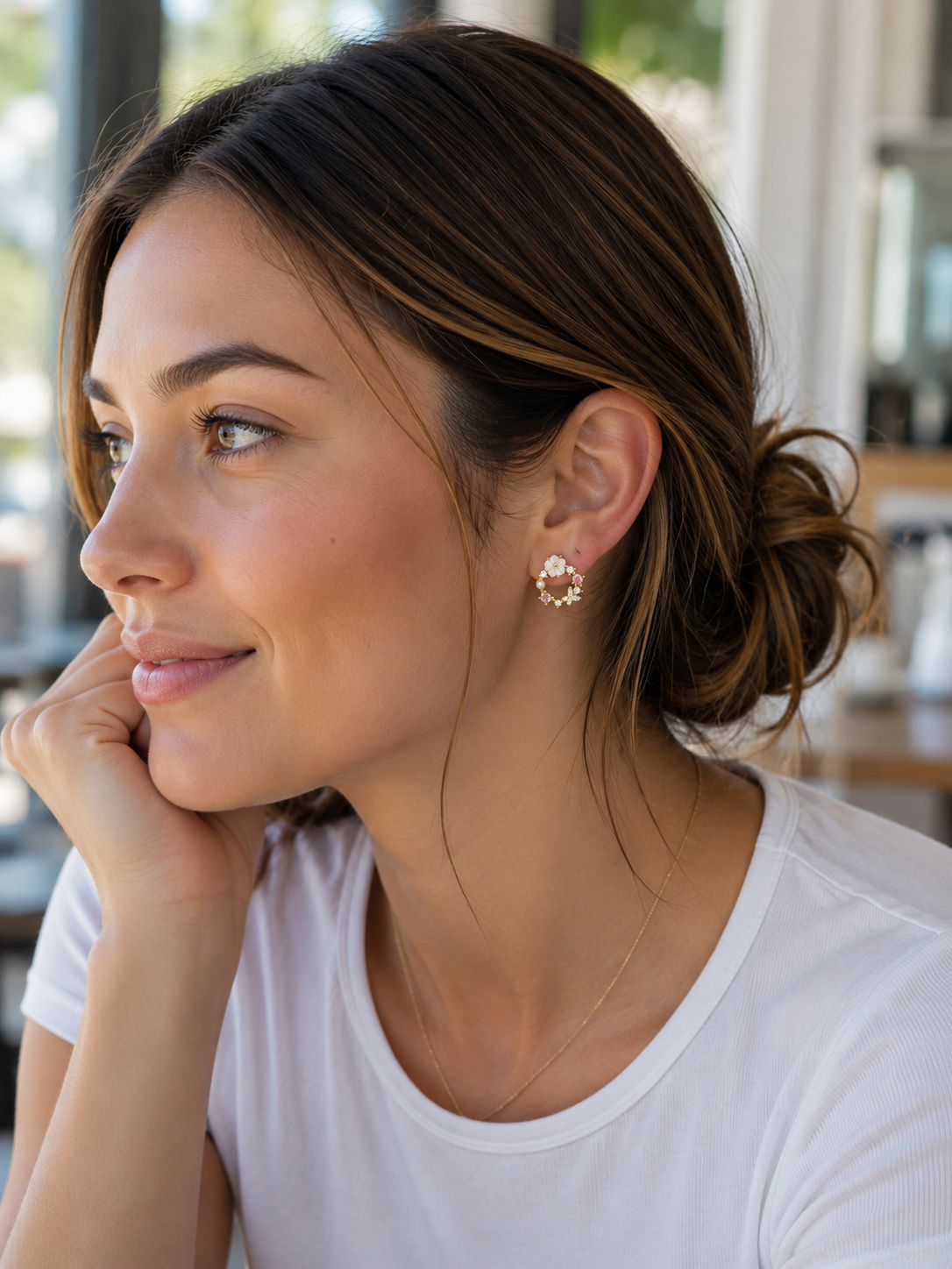 gold-plated mini hoop post-stud earrings with a petite circular silhouette, butterfly cubic zirconia stones in soft pastel shades, crystal accents, a pearl detail, floral embellishments, and gold comfort backs